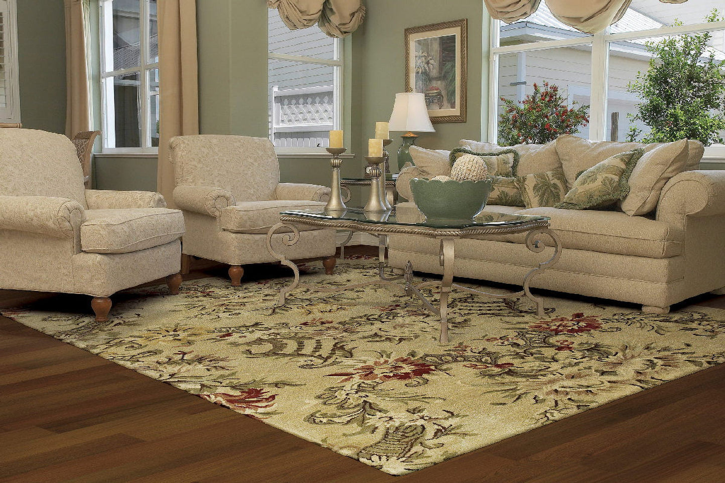A well-furnished living room featuring a stylish rug and inviting chairs.